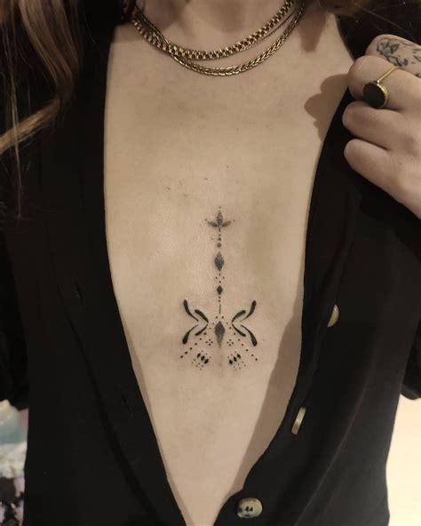 center boob tattoos|Breast Tattoos: Elegant & Intimate Designs (31 Ideas)。